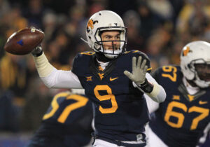 Former WVU QB hired as Big Ten offensive coordinator